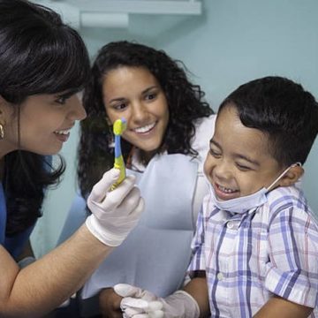 dentist-mom-teaching-kid-toothbrush