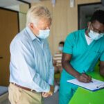 Doctor assisting a patient at an urgent care center.