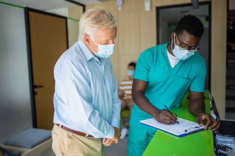 Doctor assisting a patient at an urgent care center.
