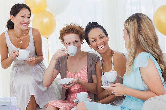 friends-drinking-tea-and-chatting-at-a-party