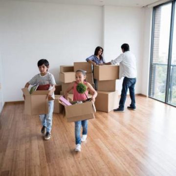 happy-family-moving-boxes-house