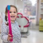 girl-toothbrush-dentist