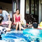 family playing in the swimming pool safe