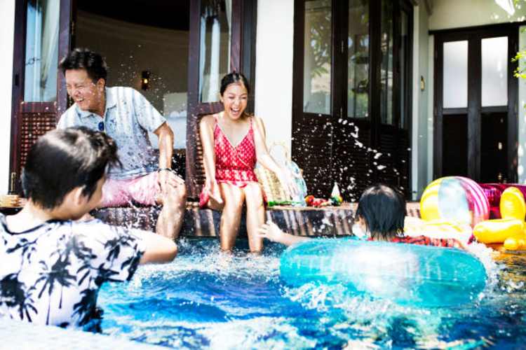 family playing in the swimming pool safe