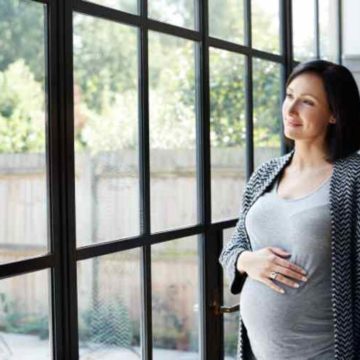 woman-pregnant-window